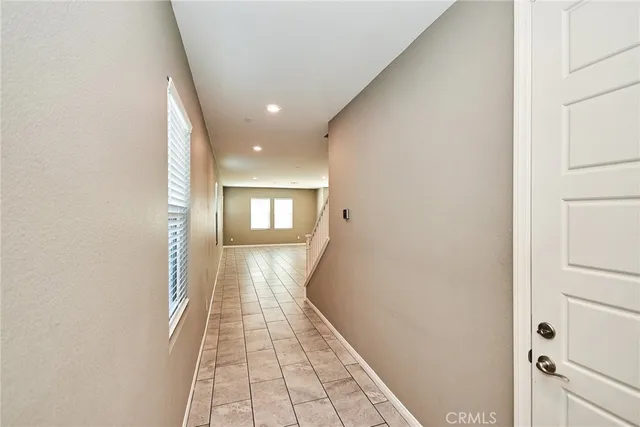 a view of hallway with wooden floor