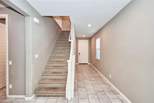 a view of a hallway with stairs