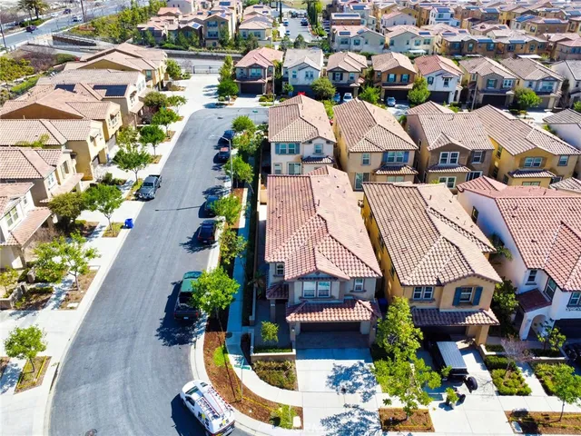 an aerial view of residential houses with outdoor space