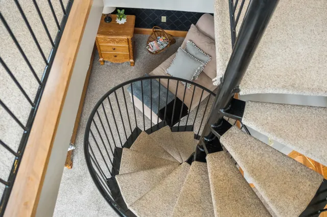 a bathroom with a granite countertop sink a toilet and a mirror