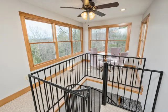 a bedroom with a bed next to a window