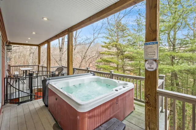 a view of an entryway with wooden floor and door