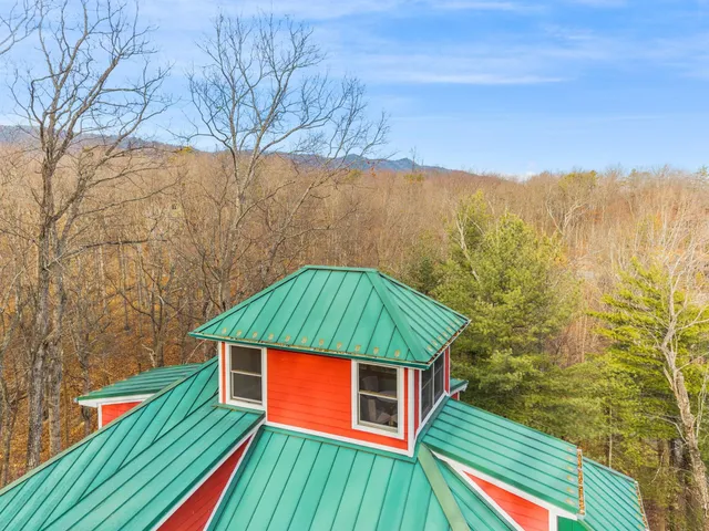 a view of a backyard with wooden fence