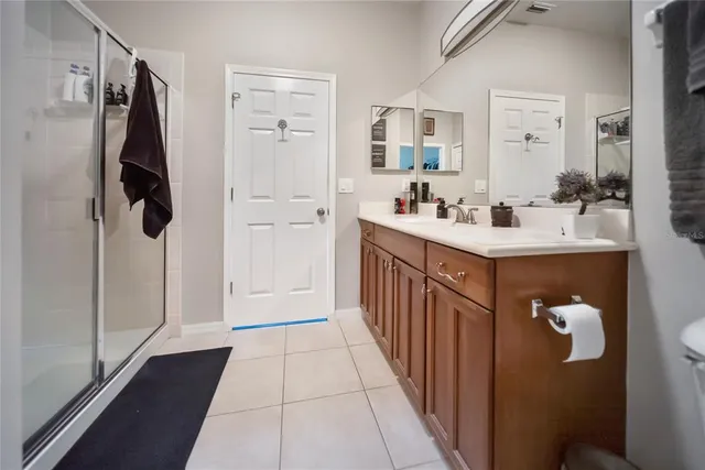 a view of walk in closet with clothes