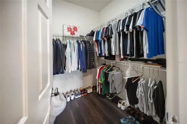 a view of a workspace with furniture and a flat screen tv