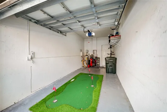 a front view of a house with a yard and a garage