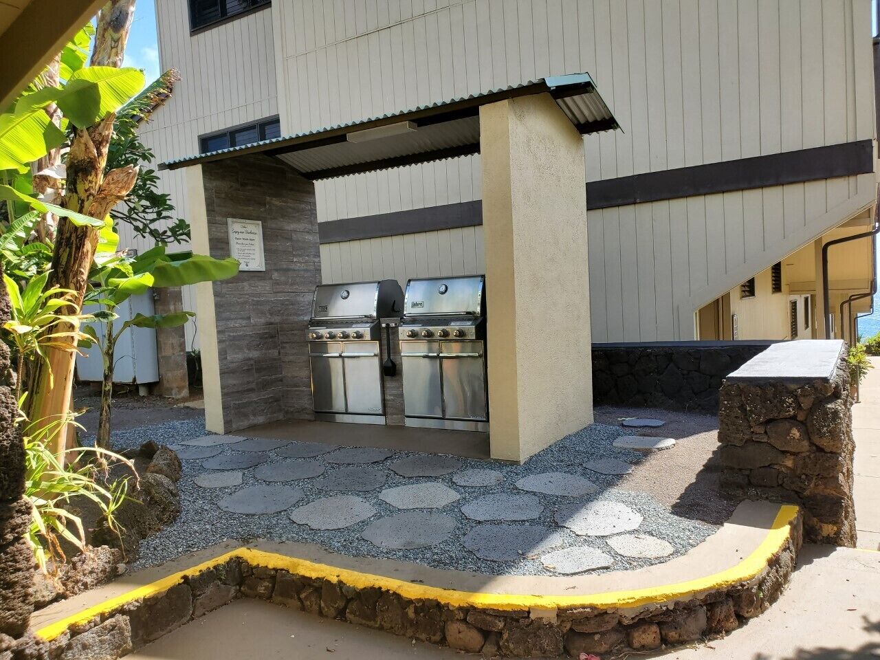 1661 Pee Road, Unit IIA312 Koloa, HI 96756 - Photo 18 of 30 a kitchen with furniture and a fireplace