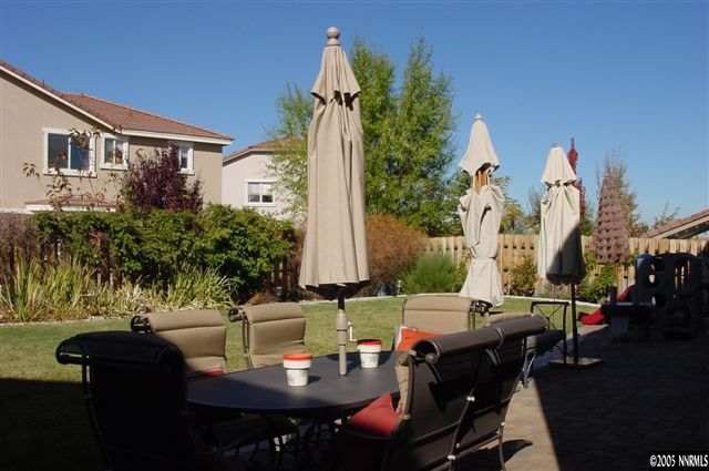 2931 Blue Grouse Drive Reno, NV 89509 - Photo 6 of 8 a view of a patio with table and chairs and potted plants