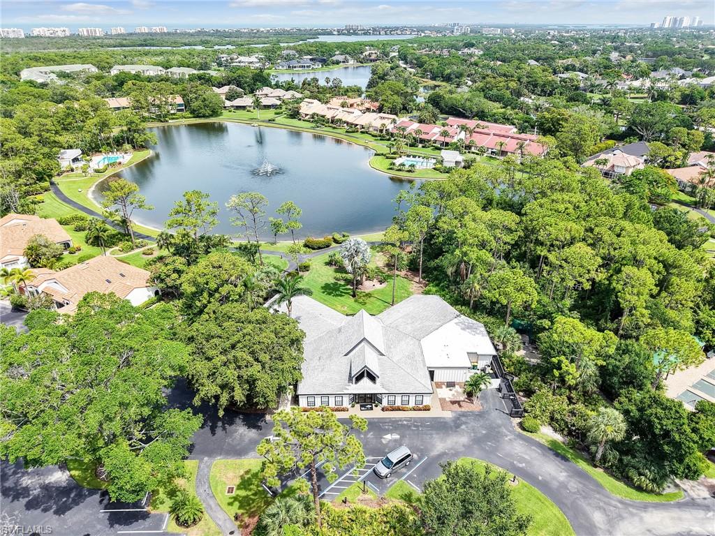 15337 Wimborne Lane, Unit 5 Naples, FL 34110 - Photo 27 of 37 an aerial view of residential house with outdoor space and lake view