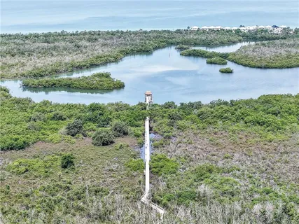 a view of a tennis court with sitting area