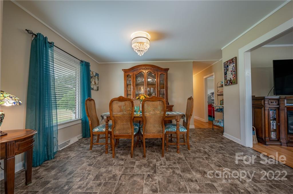 124 Crestview Street Rutherfordton, NC 28139 - Photo 11 of 28 a view of a dining room with furniture and a window