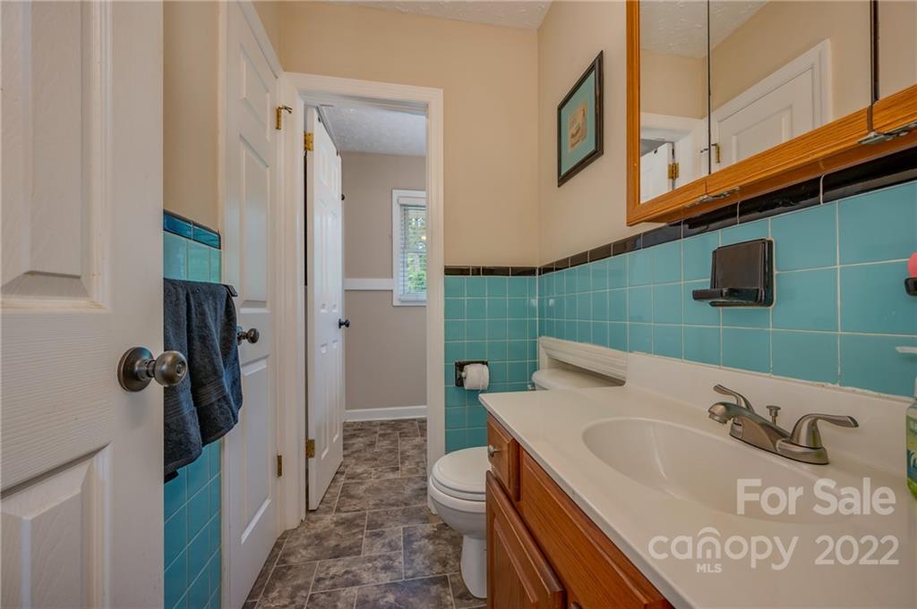 124 Crestview Street Rutherfordton, NC 28139 - Photo 18 of 28 a bathroom with a sink a toilet and shower