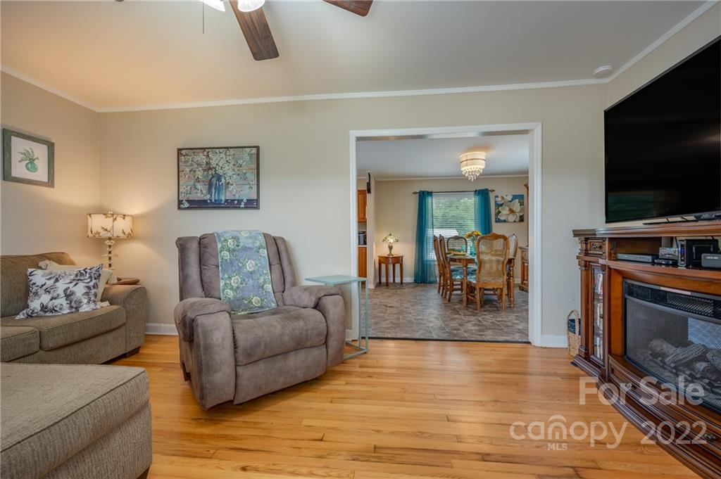 124 Crestview Street Rutherfordton, NC 28139 - Photo 7 of 28 a living room with furniture and a flat screen tv