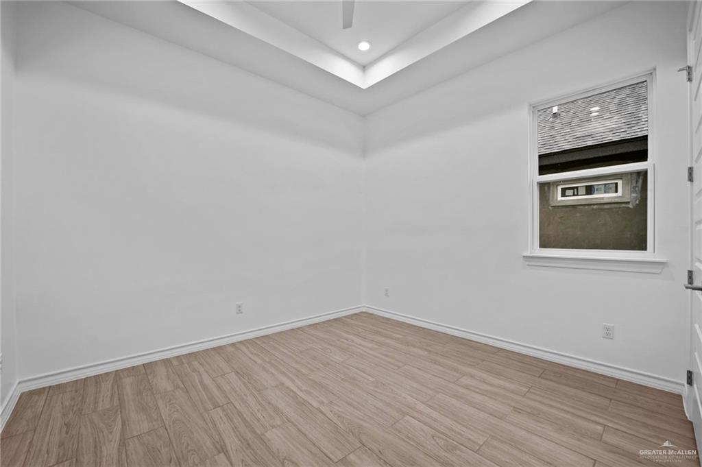 2716 East Conroe Road Edinburg, TX 78542 - Photo 20 of 31 Spare room with light wood finished floors and recessed lighting