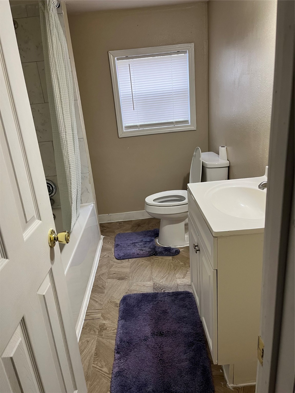 305 7th Street Rosenberg, TX 77471 - Photo 25 of 28 a bathroom with a sink and a toilet