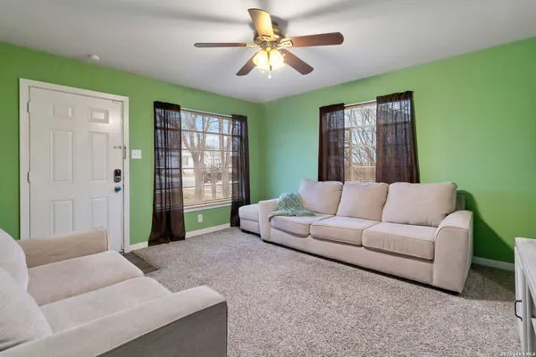a living room with furniture and a window