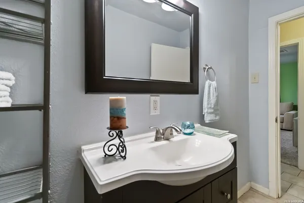 a bathroom with a sink and a mirror