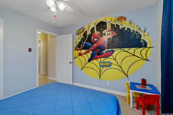 a view of a bedroom with a bed