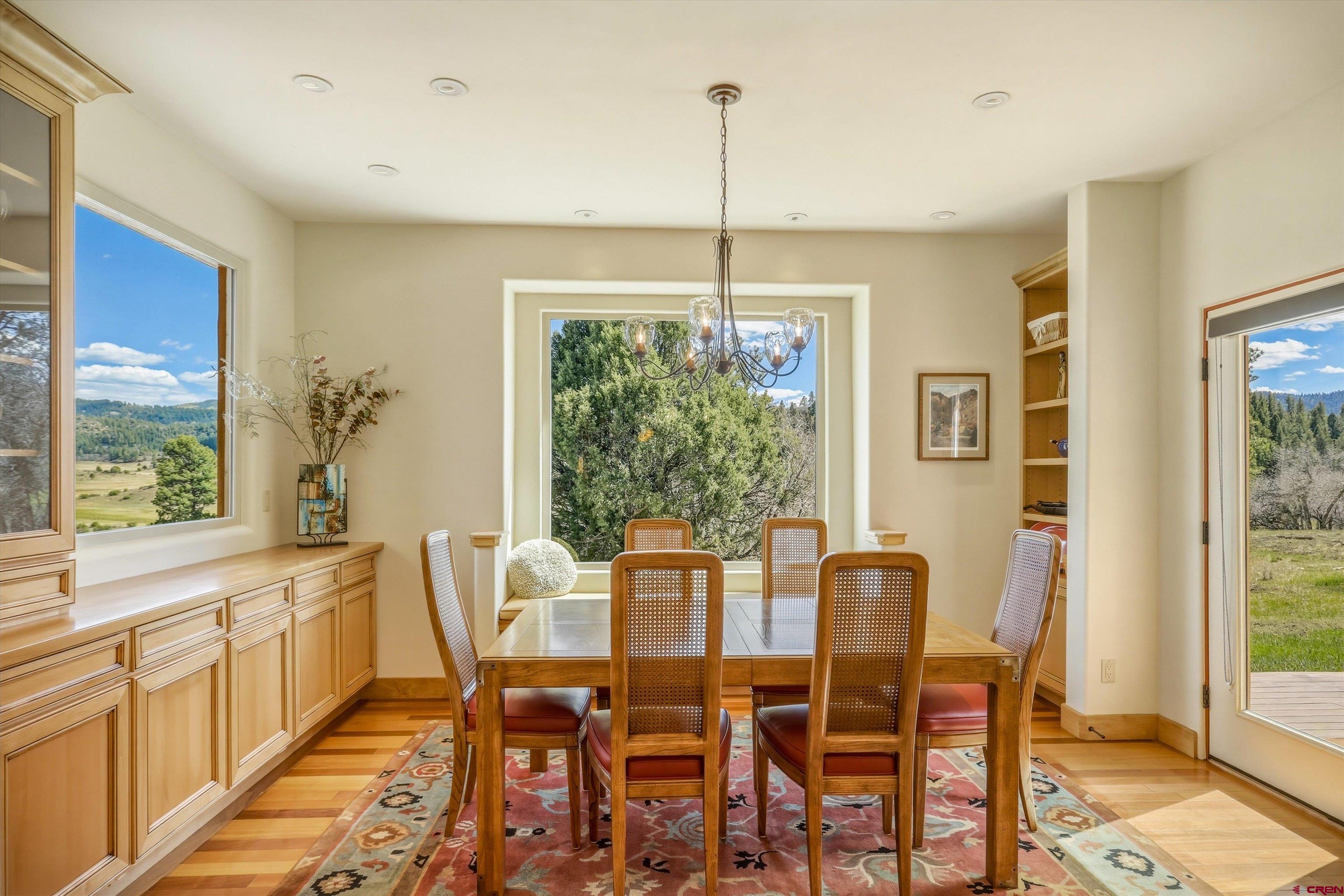 719 Spring Creek Circle Chromo, CO 81128 - Photo 13 of 45 a view of a dining room with furniture window and outside view