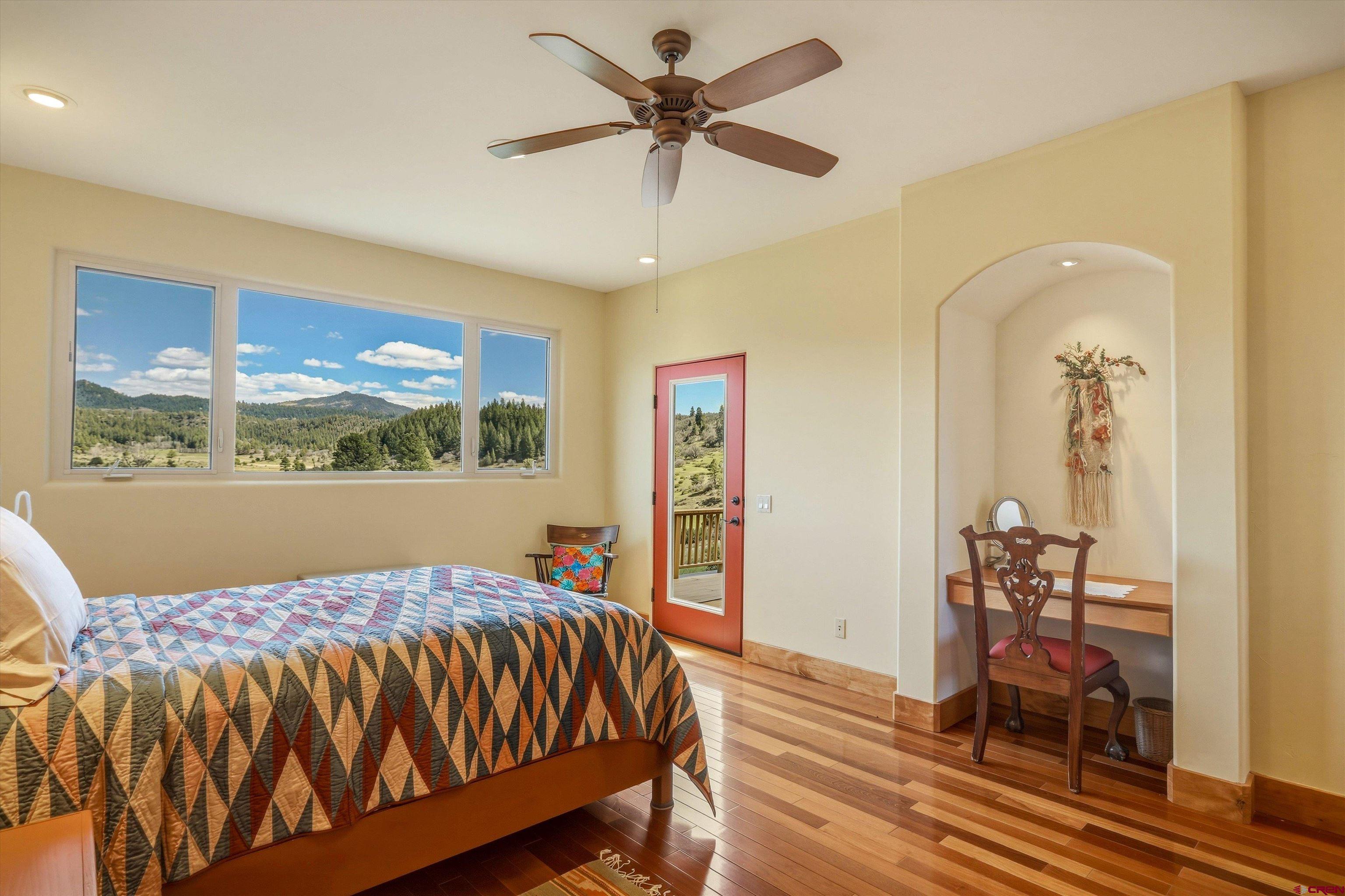 719 Spring Creek Circle Chromo, CO 81128 - Photo 16 of 45 a bed sitting in a room next to a window