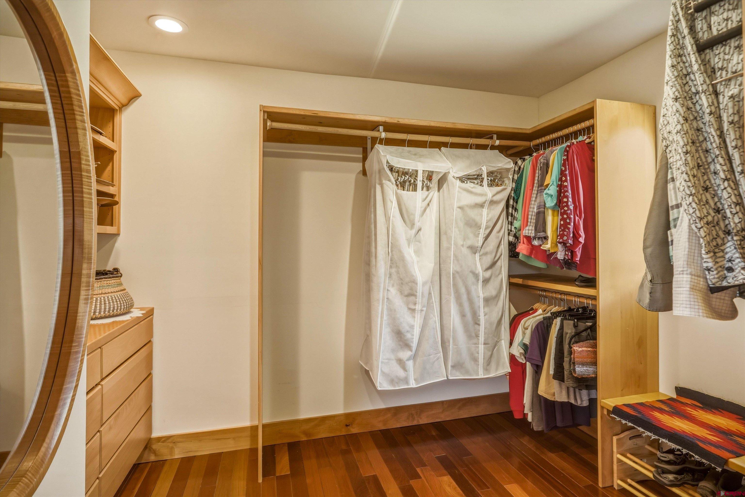 719 Spring Creek Circle Chromo, CO 81128 - Photo 18 of 45 a view of walk in closet with clothes and shoes