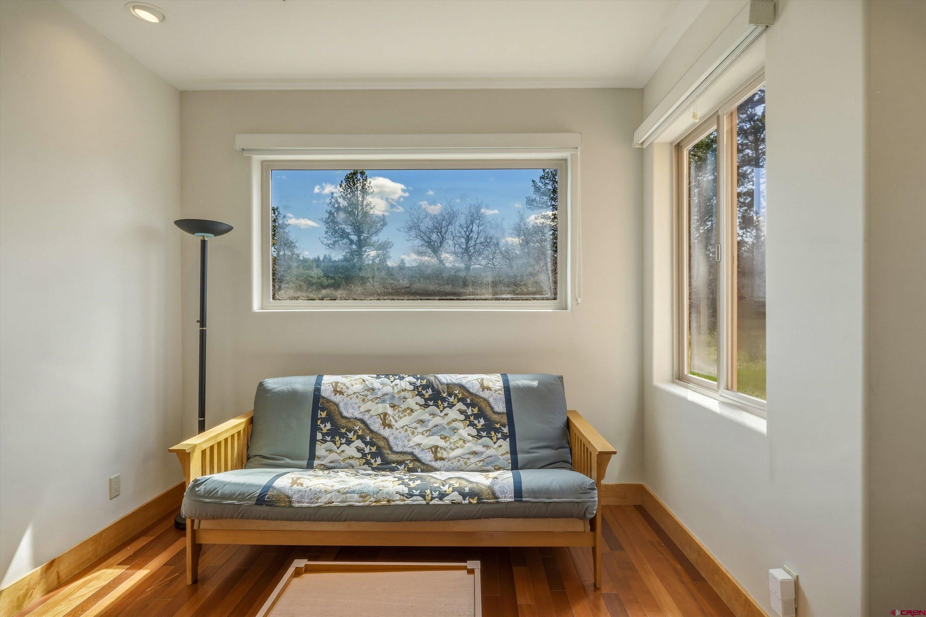 719 Spring Creek Circle Chromo, CO 81128 - Photo 25 of 45 a living room with furniture and a window
