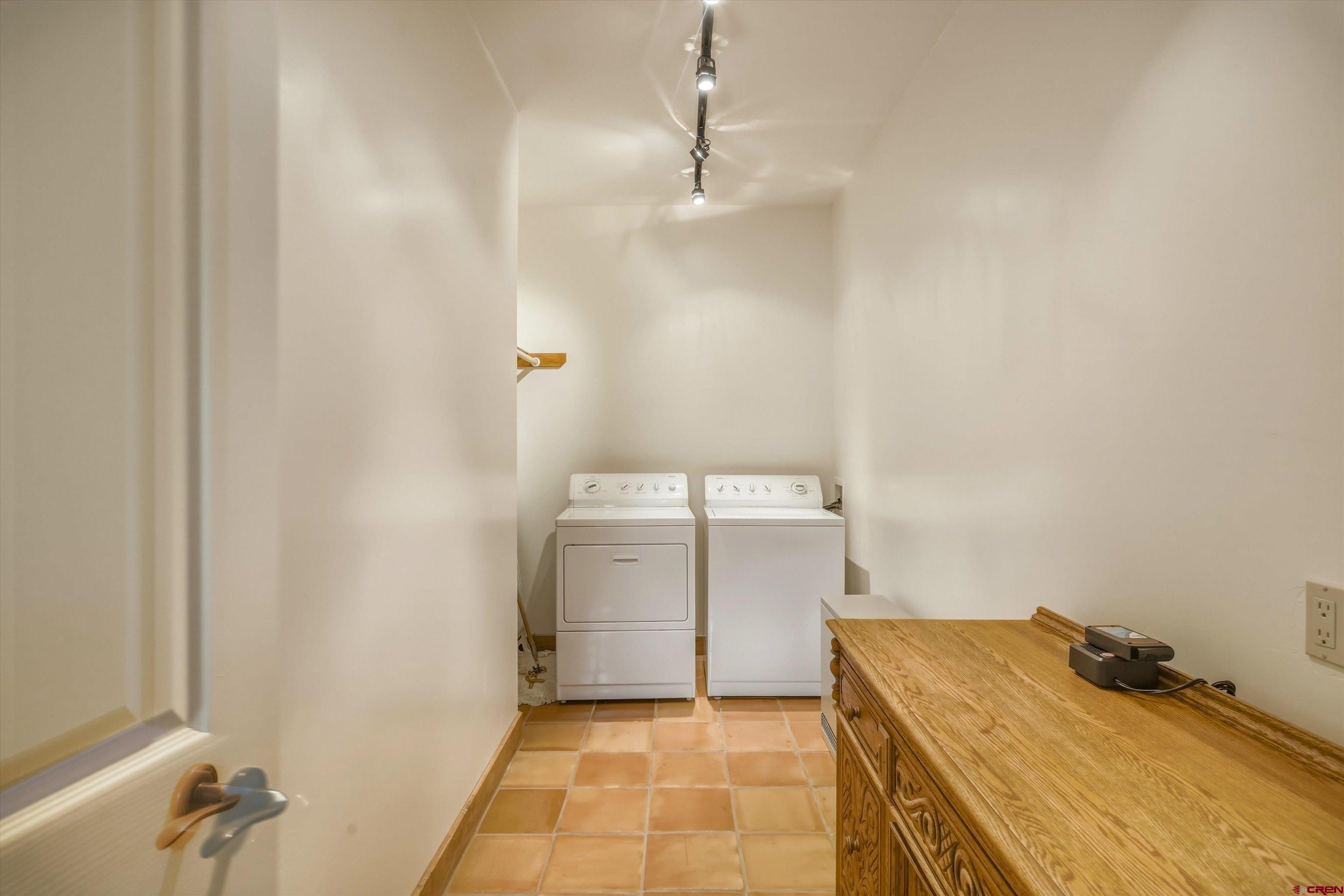 719 Spring Creek Circle Chromo, CO 81128 - Photo 27 of 45 a utility room with a washer and dryer