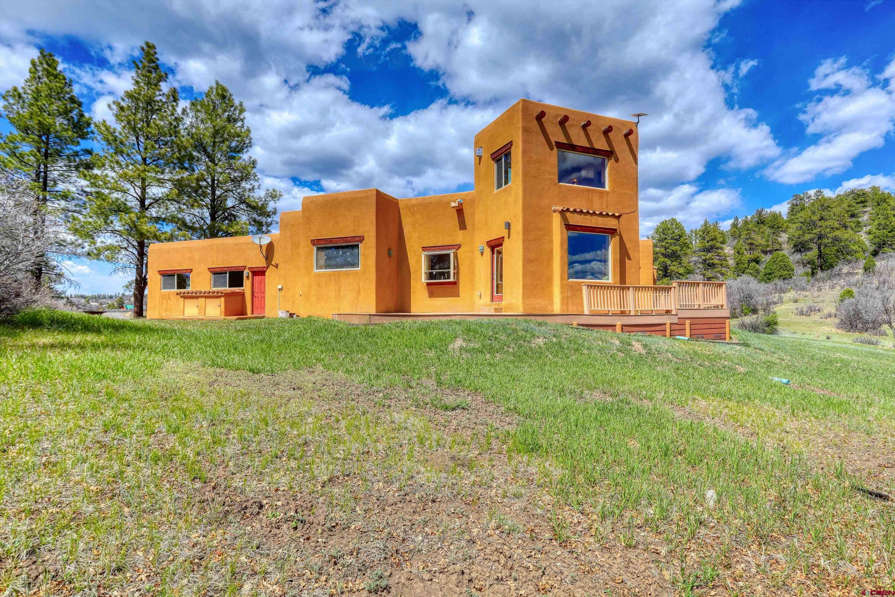 719 Spring Creek Circle Chromo, CO 81128 - Photo 30 of 45 a front view of a house with garden