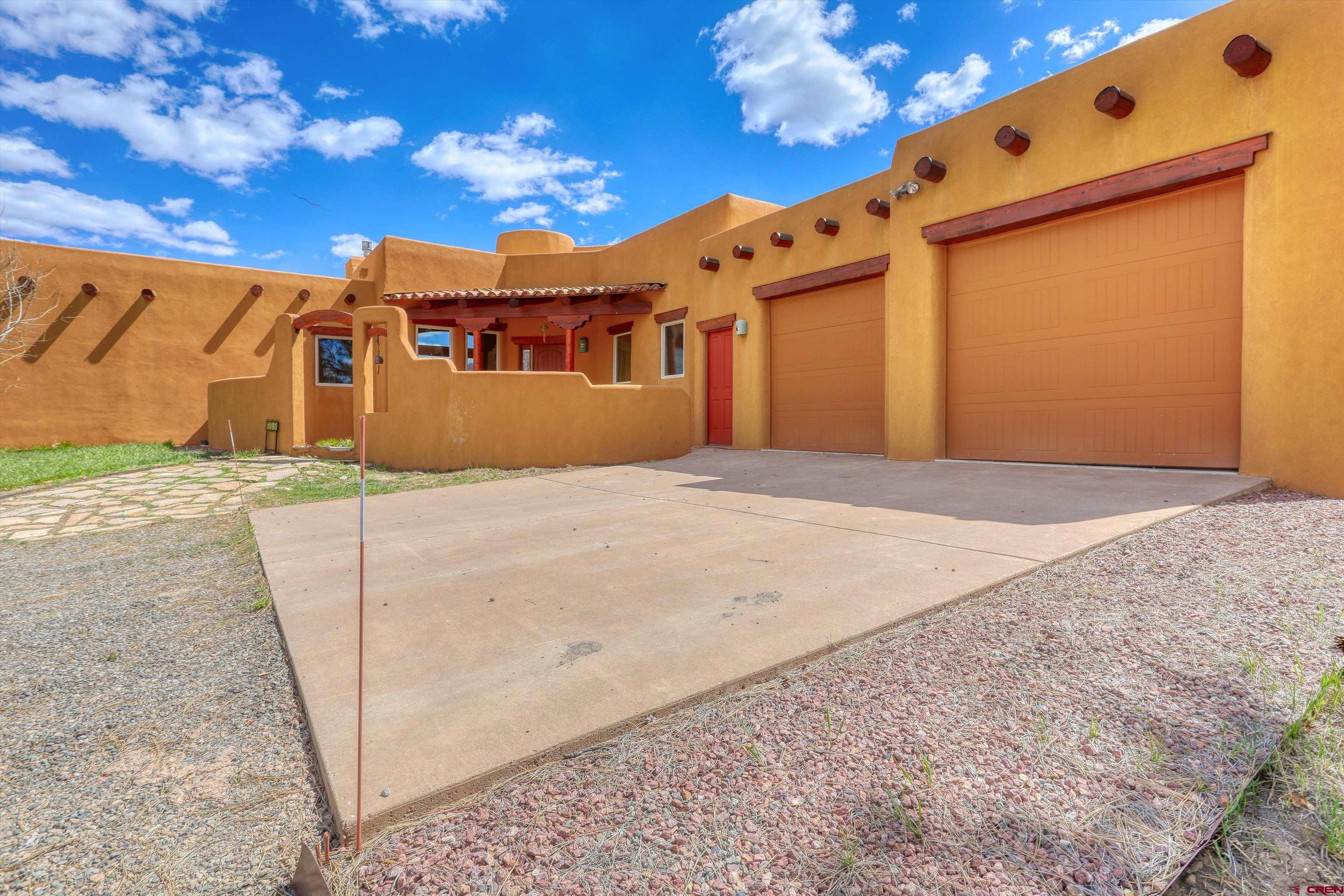 719 Spring Creek Circle Chromo, CO 81128 - Photo 36 of 45 a front view of a house with a big yard