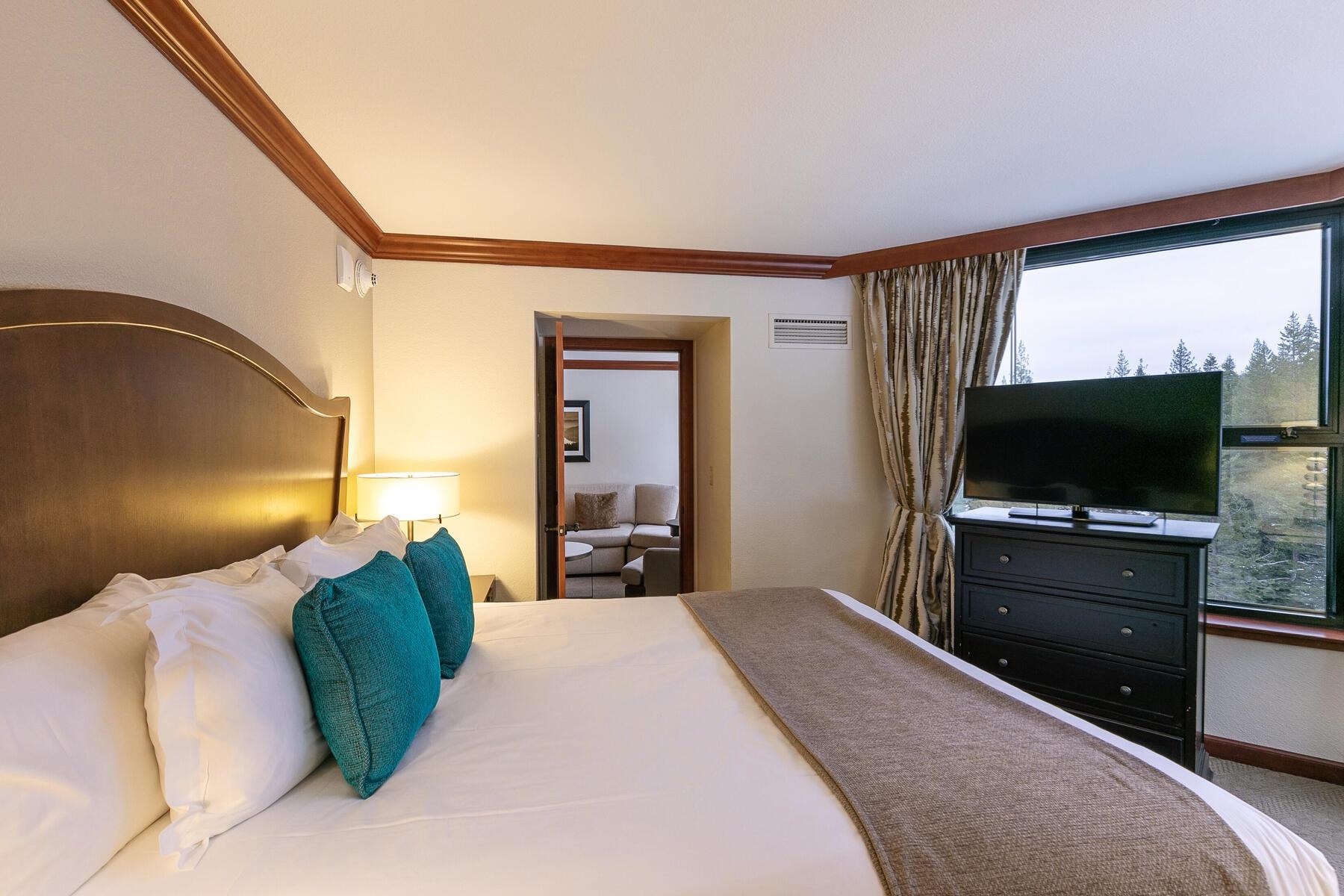 400 Squaw Creek Road, Unit 755 Olympic Valley, CA 96146 - Photo 14 of 20 a bedroom with a large bed and a flat screen tv
