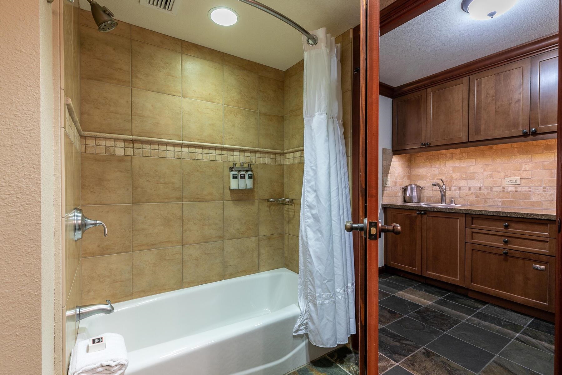 400 Squaw Creek Road, Unit 755 Olympic Valley, CA 96146 - Photo 16 of 20 a bathroom with a bathtub and a shower