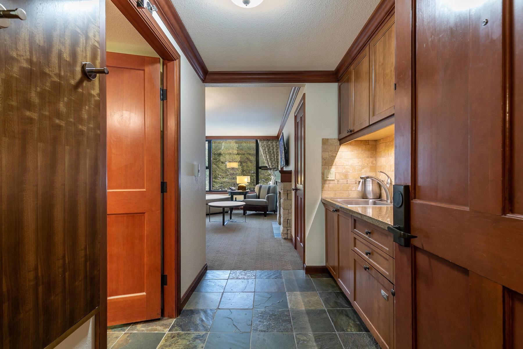 400 Squaw Creek Road, Unit 755 Olympic Valley, CA 96146 - Photo 4 of 20 a view of a hallway and a livingroom with furniture
