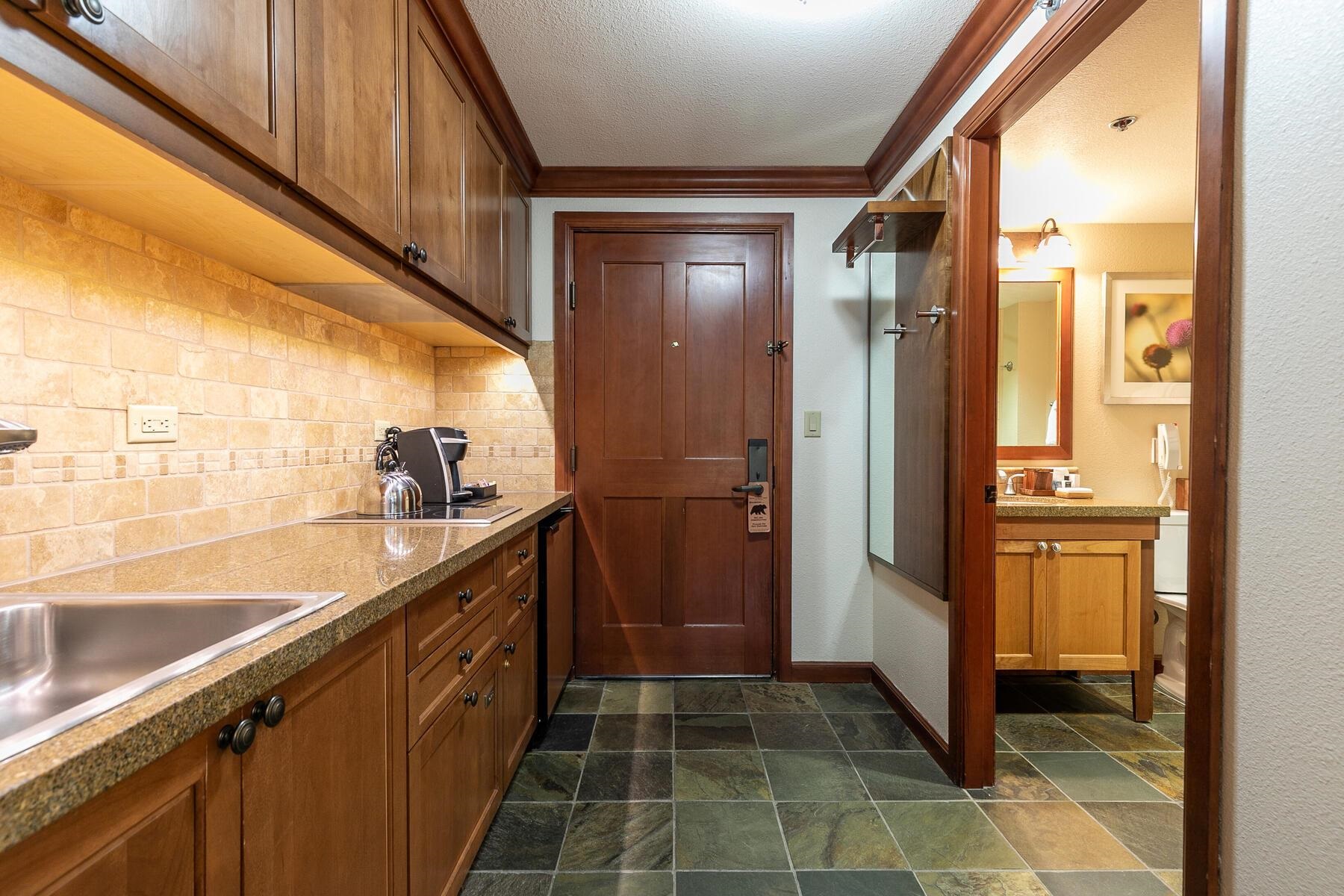 400 Squaw Creek Road, Unit 755 Olympic Valley, CA 96146 - Photo 5 of 20 a kitchen with stainless steel appliances granite countertop a refrigerator and a sink
