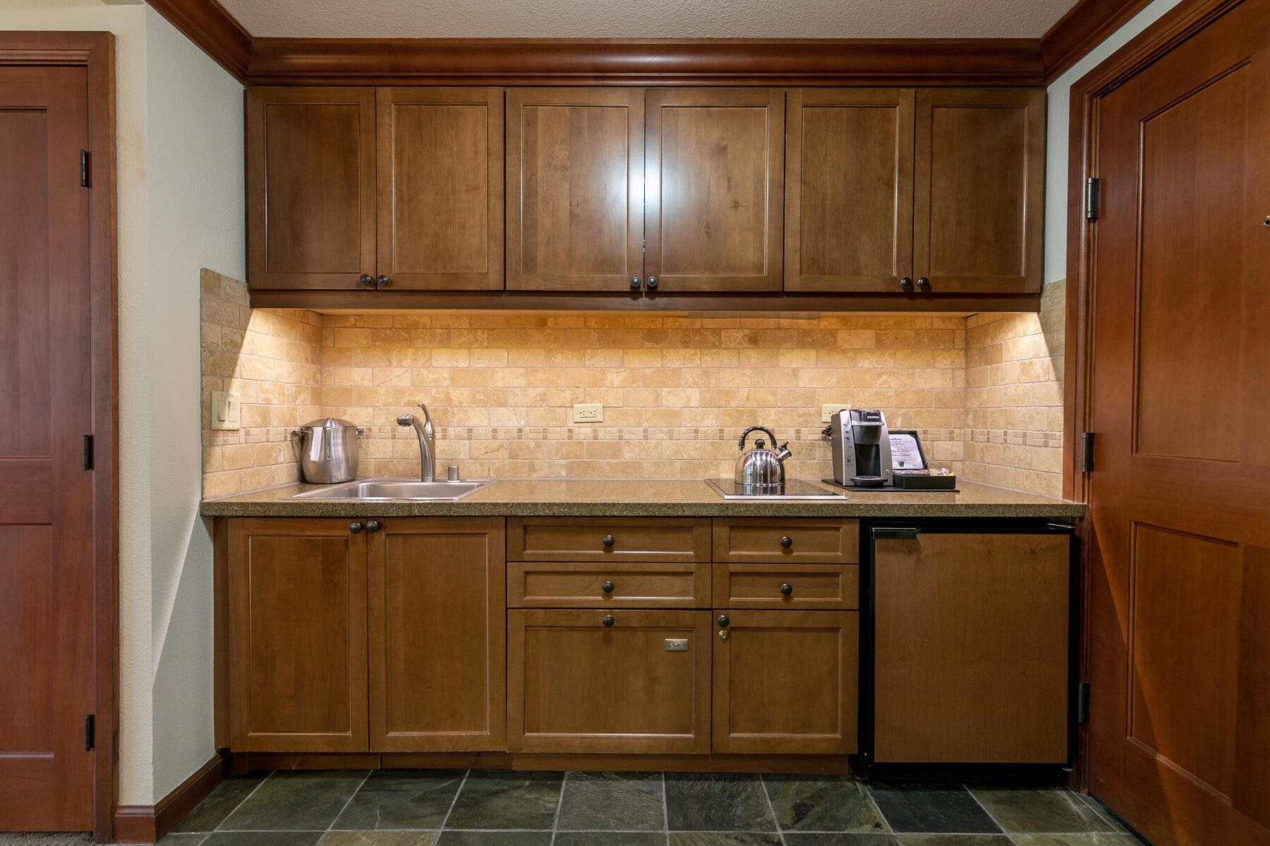 400 Squaw Creek Road, Unit 755 Olympic Valley, CA 96146 - Photo 6 of 20 a kitchen with stainless steel appliances granite countertop a sink and cabinets