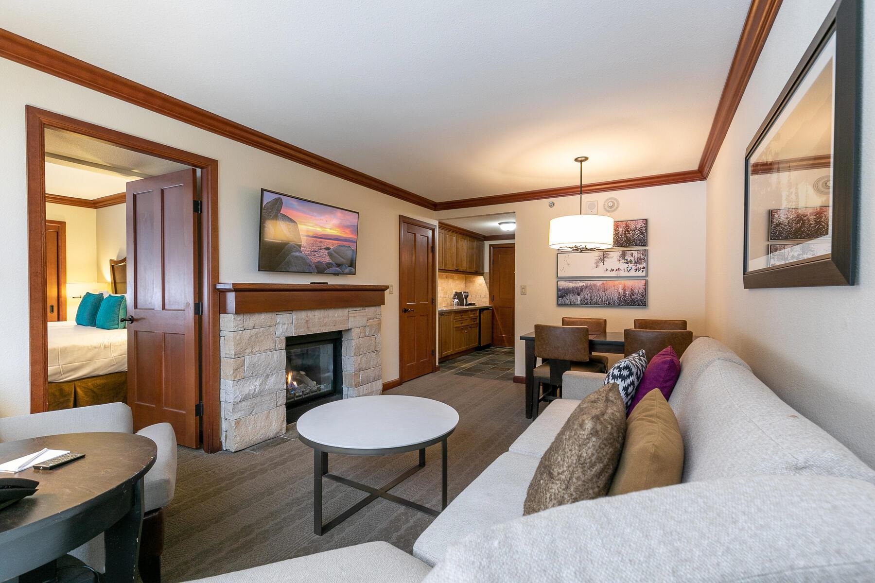 400 Squaw Creek Road, Unit 755 Olympic Valley, CA 96146 - Photo 7 of 20 a living room with furniture and a fireplace