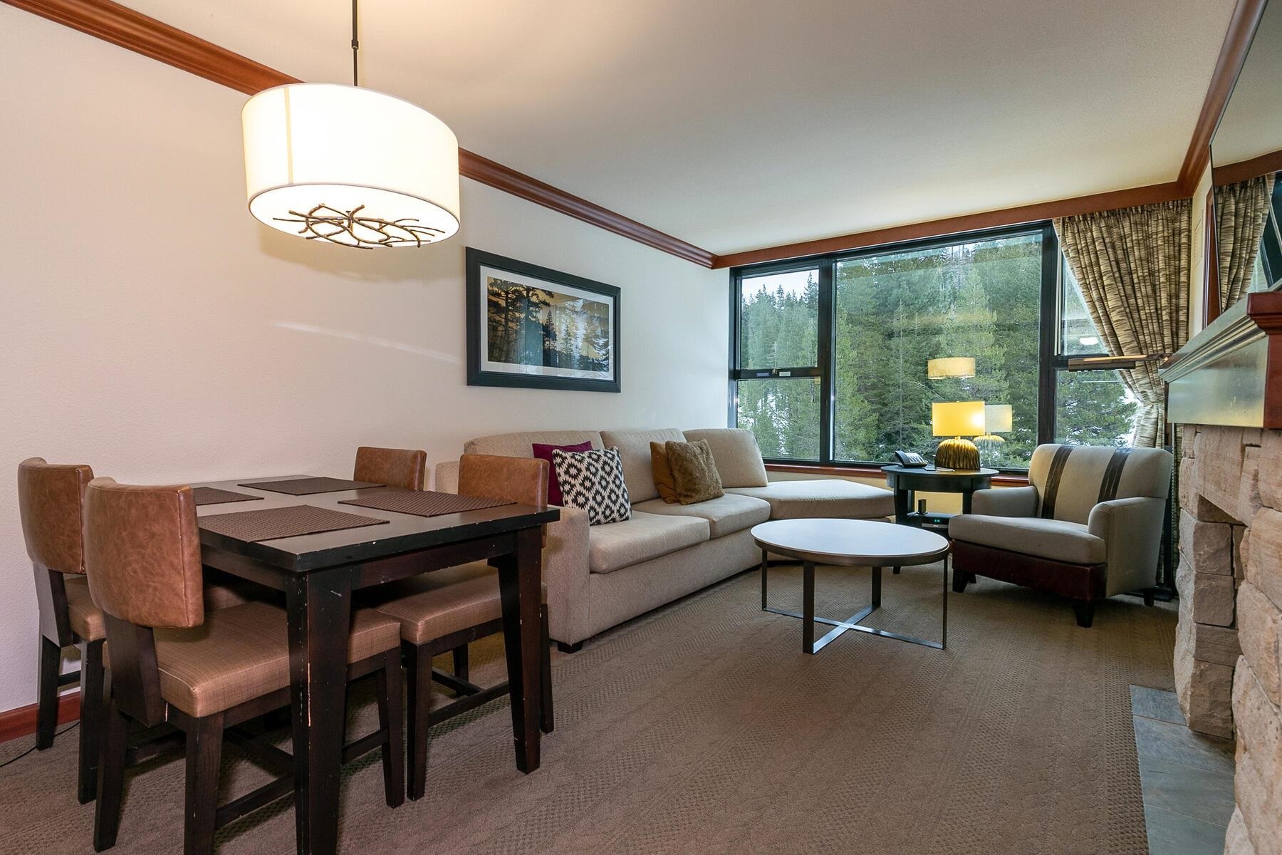 400 Squaw Creek Road, Unit 755 Olympic Valley, CA 96146 - Photo 8 of 20 a living room with furniture and a floor to ceiling window