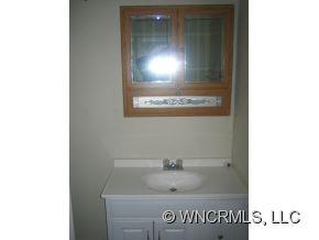 40 Substation Road Canton, NC 28716 - Photo 8 of 10 a bathroom with a sink and mirror