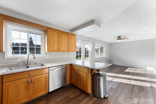 a kitchen with a sink stove and cabinets