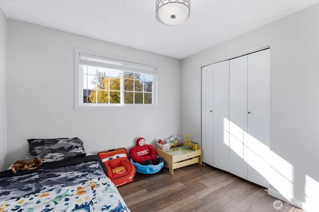 a bedroom with furniture and a window