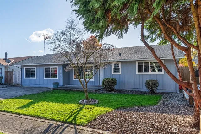 a front view of a house with garden