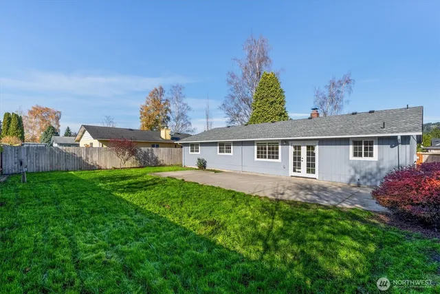 a front view of house with yard and green space