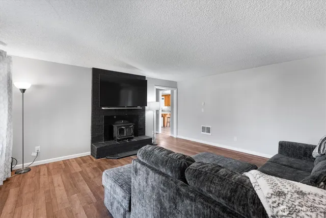 a spacious bedroom with a bed and a television