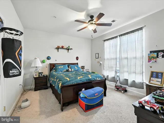 a bed room with furniture and a window