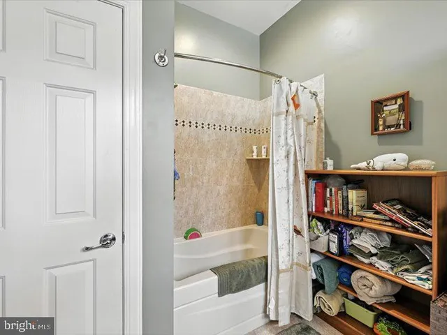 a bathroom with a double vanity sink and a shower