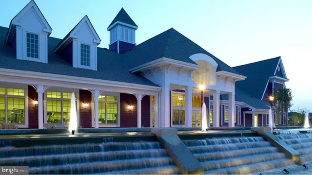 an aerial view of residential house with outdoor space and swimming pool