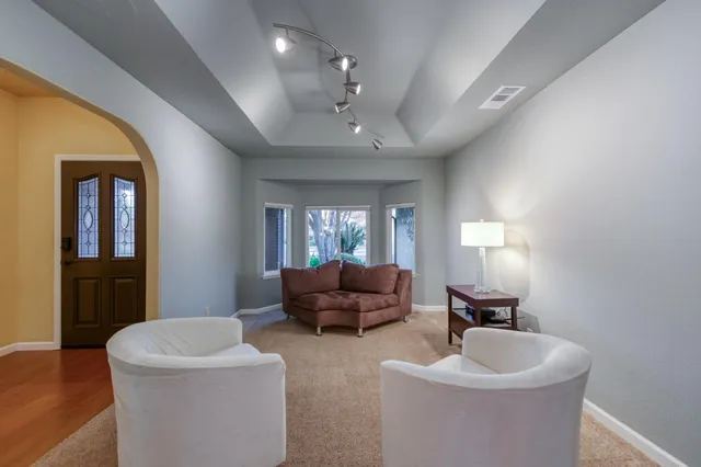 a bedroom with a large bed and a large window