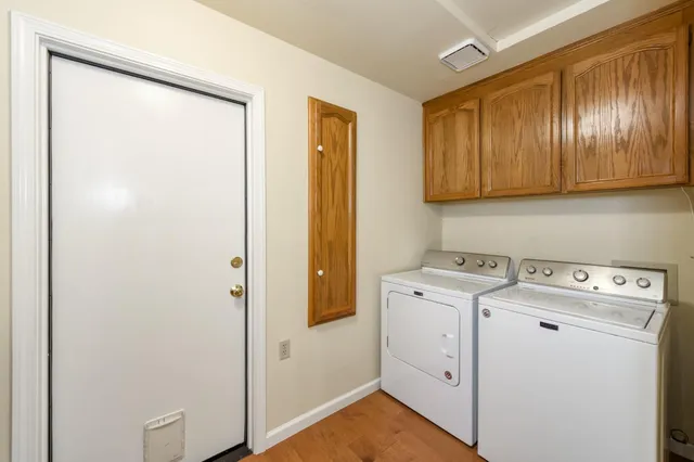 a front view of a house with a yard table and chairs