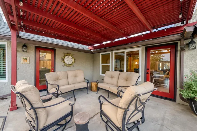 a view of a backyard with sitting area