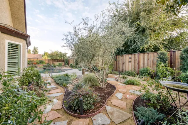 a front view of house with yard and outdoor seating