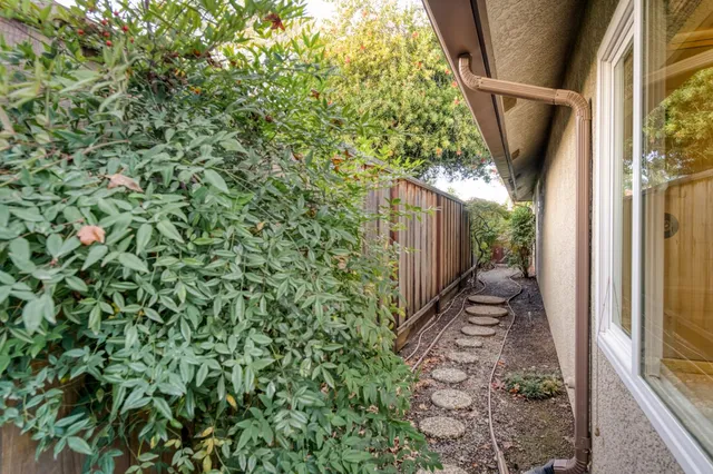 a view of a backyard with sitting area and furniture